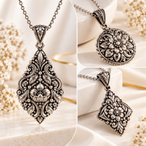 Antique-style floral pendant necklace featuring intricate ornamental patterns and a matching chain.